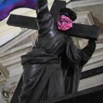 Jesus Monument Desecrated with LGBTQ Rainbow Flag & Anarchist Symbol Mask in Poland