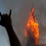 Demonstrators burn two churches in Chile on anniversary of protests